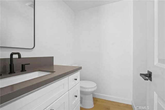 22983 Via Cereza Unit 3B, Mission Viejo, CA 92691 - half bath featuring vanity and wood finished floors