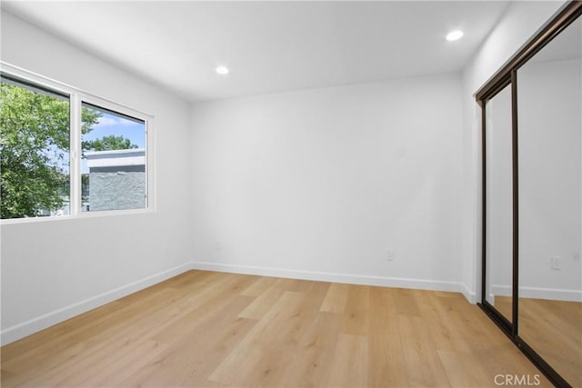 22983 Via Cereza Unit 3B, Mission Viejo, CA 92691 - unfurnished bedroom with light wood-style floors, recessed lighting, and a closet