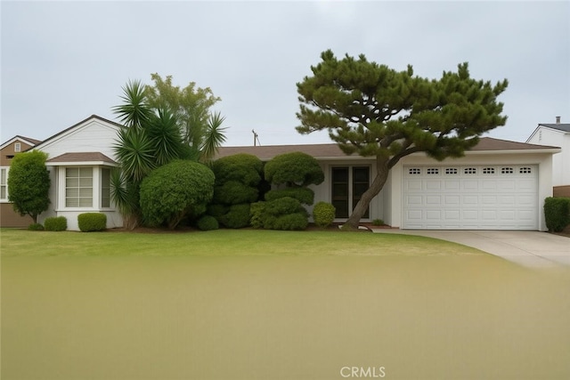 8900 S 4th Ave, Inglewood, CA 90305 - ranch-style house featuring an attached garage, driveway, a front lawn, and stucco siding