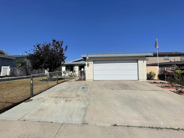 1195 Ilexey Ave, San Diego, CA 92154 - view of front of house with stucco siding, a garage, driveway, and a gate
