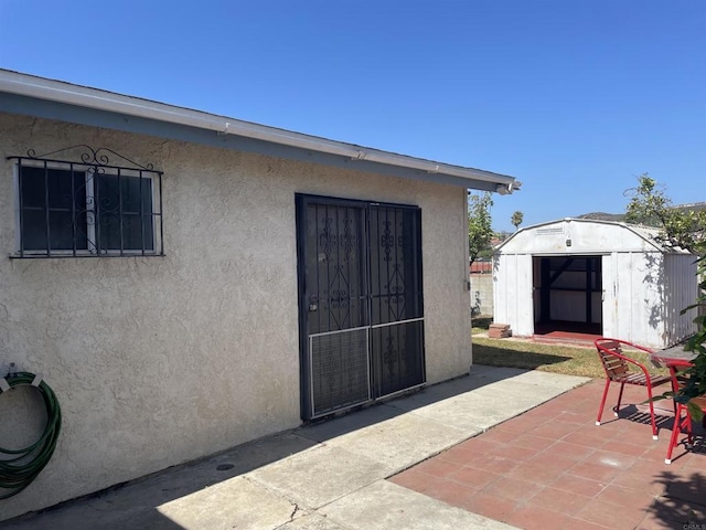 1195 Ilexey Ave, San Diego, CA 92154 - view of exterior entry featuring a patio area and stucco siding
