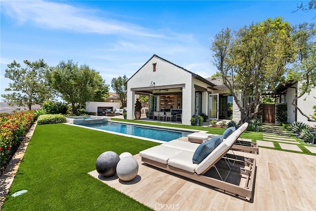 30 Catalina Vista Rd, Ladera Ranch, CA 92694 - rear view of property featuring an outdoor hangout area, a lawn, stucco siding, a pool with connected hot tub, and a patio