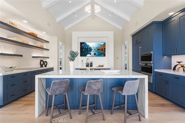 30 Catalina Vista Rd, Ladera Ranch, CA 92694 - kitchen with high vaulted ceiling, stainless steel oven, blue cabinetry, beamed ceiling, and open shelves