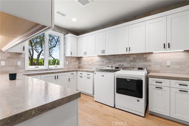 30 Catalina Vista Rd, Ladera Ranch, CA 92694 - kitchen featuring washing machine and clothes dryer, white cabinetry, tasteful backsplash, light wood finished floors, and recessed lighting