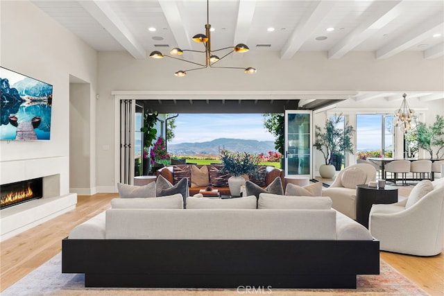 30 Catalina Vista Rd, Ladera Ranch, CA 92694 - living room featuring a chandelier, beam ceiling, light wood finished floors, a fireplace, and recessed lighting