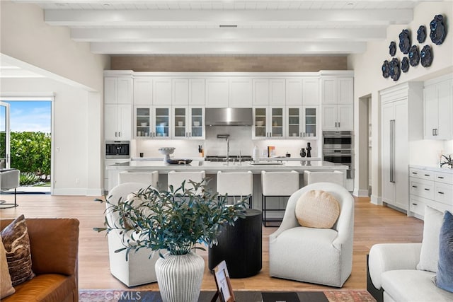 30 Catalina Vista Rd, Ladera Ranch, CA 92694 - living room featuring light wood-style floors and a wooden ceiling with exposed beams