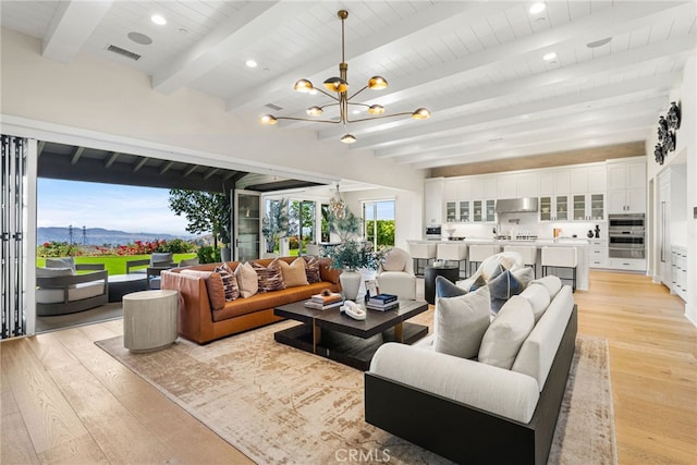 30 Catalina Vista Rd, Ladera Ranch, CA 92694 - living area featuring light wood-style floors, a chandelier, a mountain view, recessed lighting, and a wooden ceiling with exposed beams