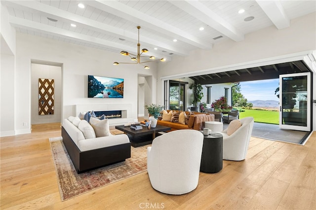 30 Catalina Vista Rd, Ladera Ranch, CA 92694 - living room featuring light wood-type flooring, a chandelier, a warm lit fireplace, recessed lighting, and a wood ceiling with exposed beams