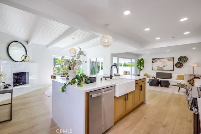 4532 Zella Ln, Yorba Linda, CA 92886 - kitchen featuring stainless steel dishwasher, open floor plan, healthy amount of natural light, beam ceiling, and a premium fireplace