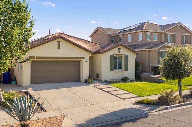 4040 Quartzite Ln, San Bernardino, CA 92407 - traditional-style home with concrete driveway, stucco siding, an attached garage, a tiled roof, and a front lawn
