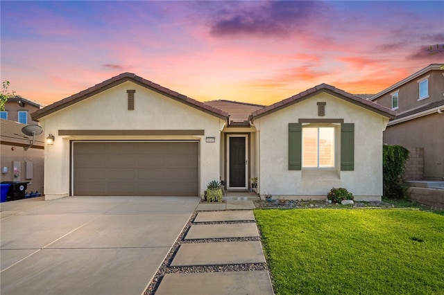4040 Quartzite Ln, San Bernardino, CA 92407 - ranch-style home with driveway, stucco siding, a garage, a yard, and a tile roof