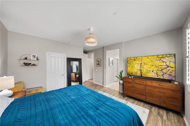 4040 Quartzite Ln, San Bernardino, CA 92407 - bedroom featuring light wood-style flooring and baseboards