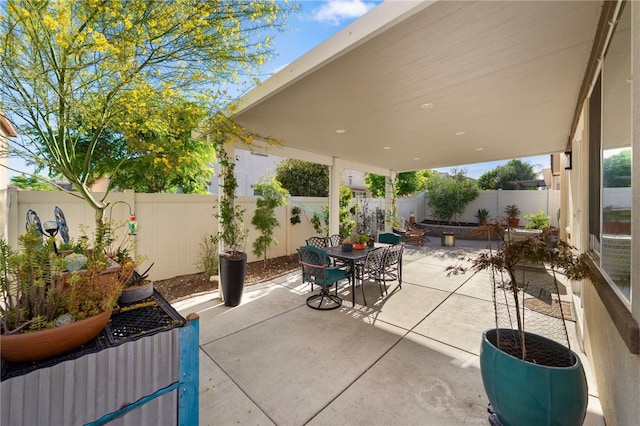 4040 Quartzite Ln, San Bernardino, CA 92407 - fenced backyard with a patio area and outdoor dining area