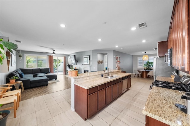 4040 Quartzite Ln, San Bernardino, CA 92407 - kitchen featuring appliances with stainless steel finishes, a kitchen island with sink, open floor plan, recessed lighting, and ceiling fan