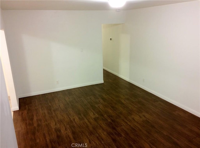 12843 Columbia Way, Downey, CA 90242 - unfurnished room featuring dark wood-style floors and baseboards
