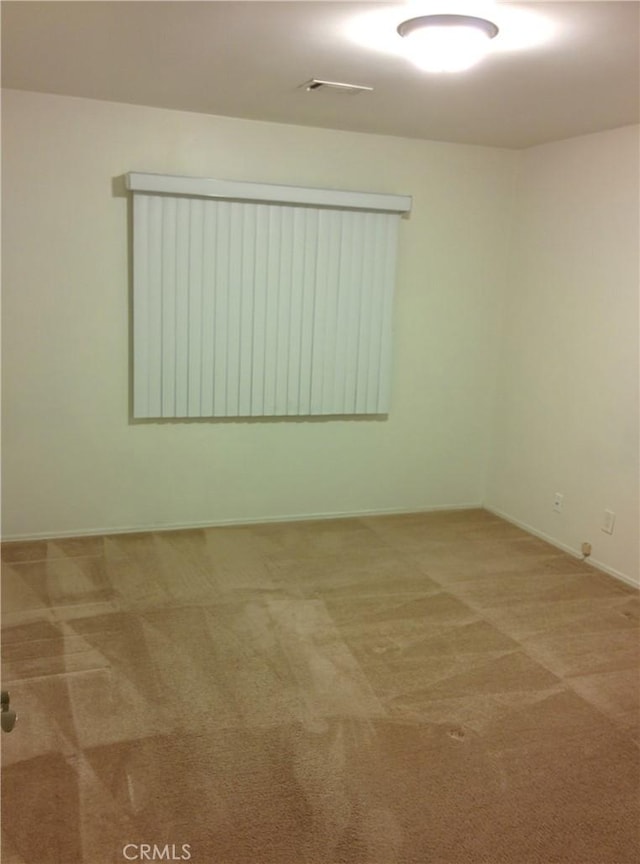 12843 Columbia Way, Downey, CA 90242 - carpeted empty room featuring baseboards