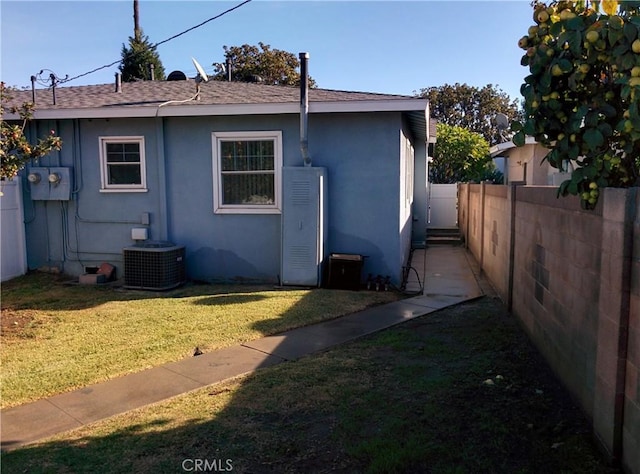 12843 Columbia Way, Downey, CA 90242 - view of side of property featuring roof with shingles and stucco siding