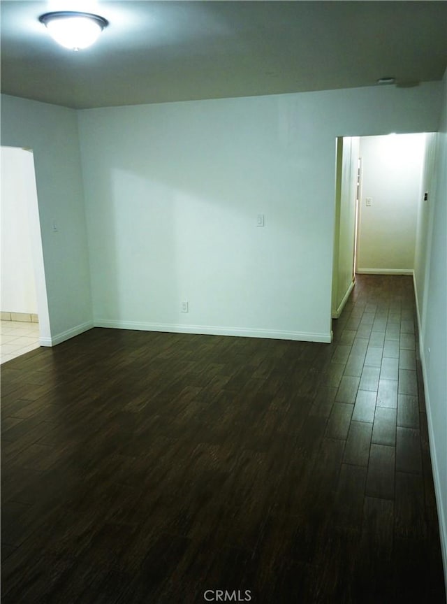 12843 Columbia Way, Downey, CA 90242 - unfurnished room featuring dark wood finished floors and baseboards