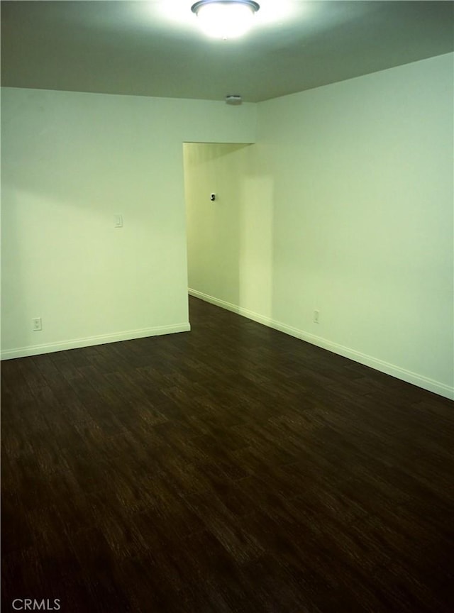 12843 Columbia Way, Downey, CA 90242 - spare room with dark wood finished floors and baseboards
