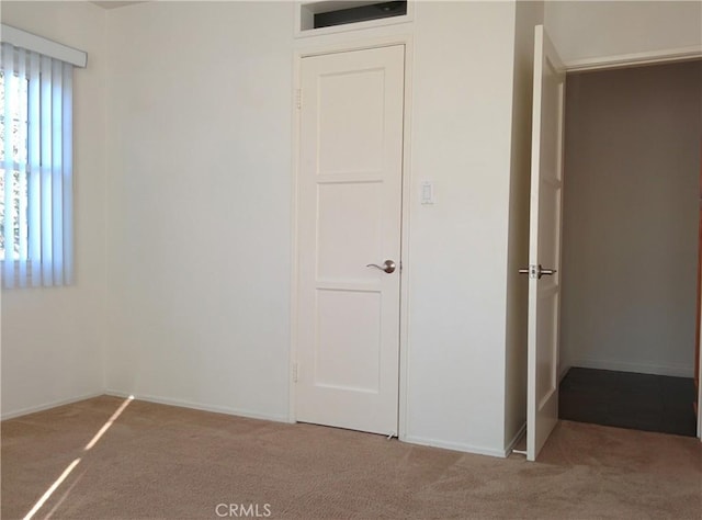 12843 Columbia Way, Downey, CA 90242 - unfurnished bedroom featuring carpet flooring and baseboards