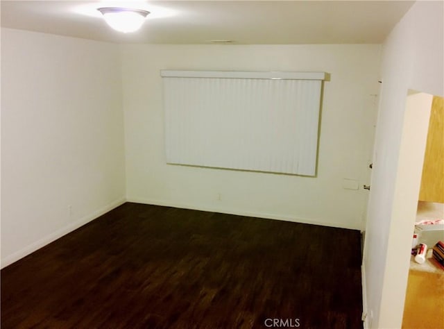 12843 Columbia Way, Downey, CA 90242 - unfurnished room with wood finished floors and baseboards