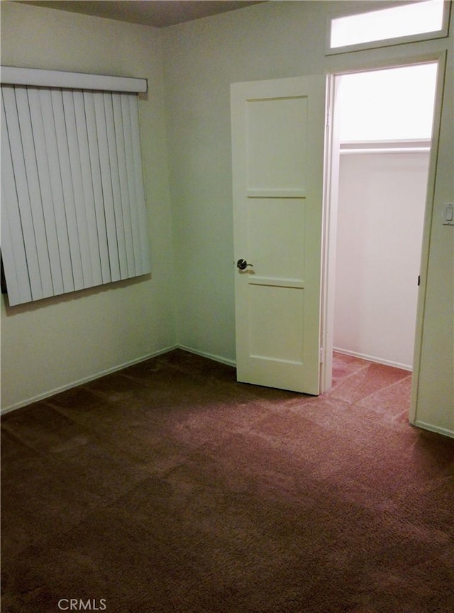 12843 Columbia Way, Downey, CA 90242 - carpeted empty room with baseboards