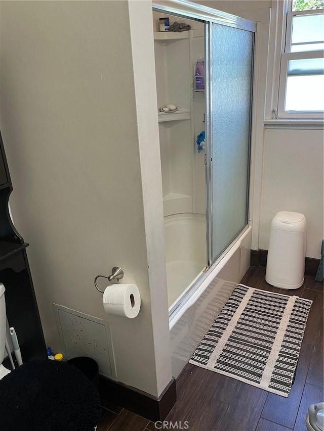 12843 Columbia Way, Downey, CA 90242 - full bath featuring wood finished floors and bath / shower combo with glass door