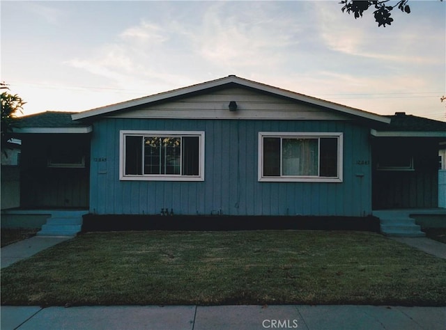 12843 Columbia Way, Downey, CA 90242 - property exterior at dusk featuring a yard
