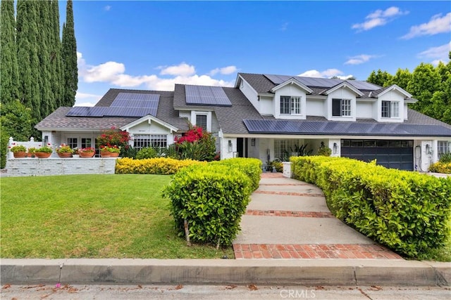 17437 Tarzana St, Encino, CA 91316 - view of front facade with a front yard, solar panels, a porch, and stucco siding