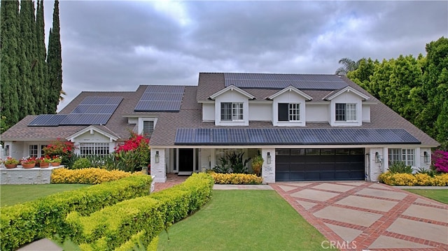 17437 Tarzana St, Encino, CA 91316 - traditional-style home featuring a front yard, driveway, and roof mounted solar panels