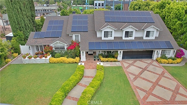 17437 Tarzana St, Encino, CA 91316 - traditional-style house featuring a front lawn, driveway, and roof mounted solar panels