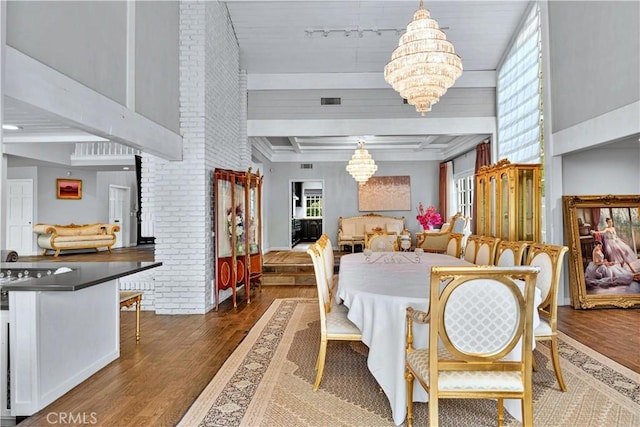 17437 Tarzana St, Encino, CA 91316 - dining space with a chandelier, wood finished floors, and beamed ceiling