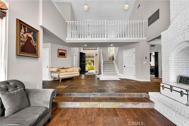 17437 Tarzana St, Encino, CA 91316 - foyer with a towering ceiling, stone tile floors, and stairway