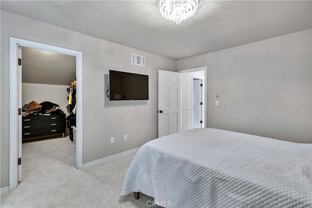 17437 Tarzana St, Encino, CA 91316 - bedroom featuring a walk in closet, light colored carpet, a closet, and a chandelier