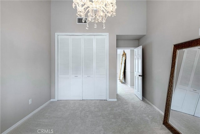 17437 Tarzana St, Encino, CA 91316 - unfurnished bedroom featuring carpet flooring, a chandelier, a closet, and a high ceiling
