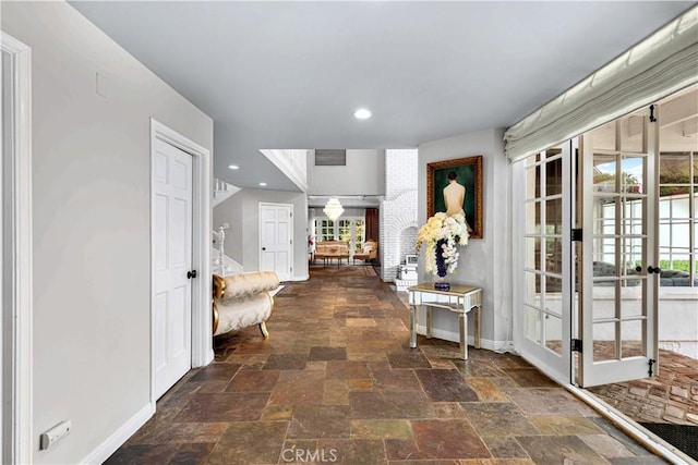 17437 Tarzana St, Encino, CA 91316 - foyer with french doors, stone tile floors, and recessed lighting