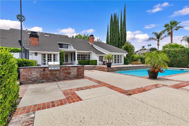 17437 Tarzana St, Encino, CA 91316 - swimming pool featuring area for grilling, french doors, and a patio area