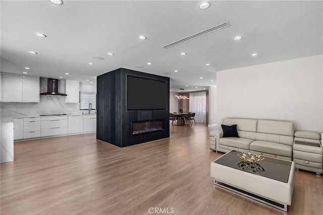 16810 Adlon Rd, Encino, CA 91436 - living area with light wood-style floors and recessed lighting