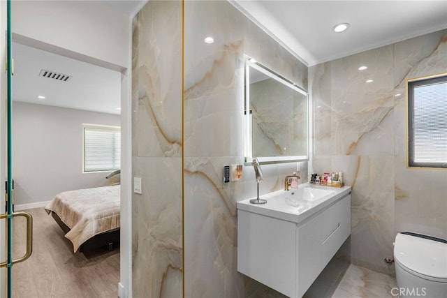 16810 Adlon Rd, Encino, CA 91436 - full bath with tile walls, vanity, a marble finish shower, recessed lighting, and ensuite bathroom
