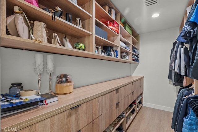 16810 Adlon Rd, Encino, CA 91436 - walk in closet with light wood-style floors