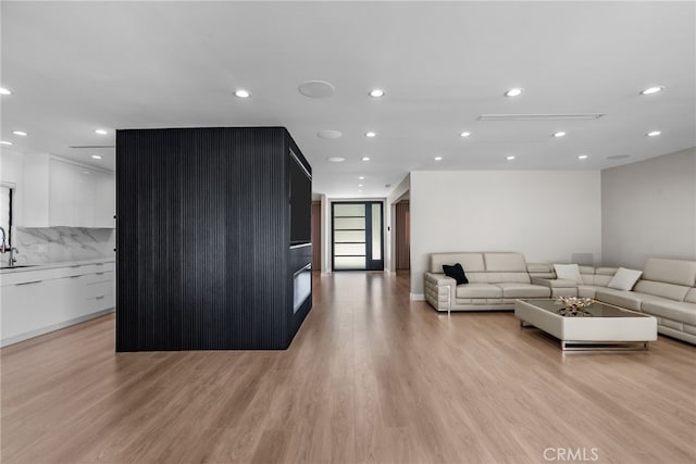 16810 Adlon Rd, Encino, CA 91436 - living room featuring light wood finished floors and recessed lighting