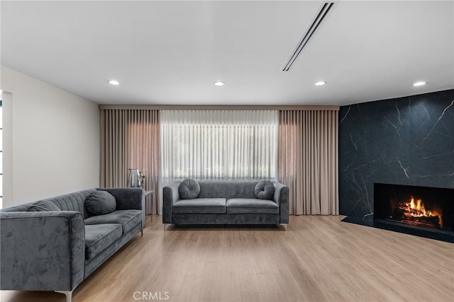 16810 Adlon Rd, Encino, CA 91436 - living room featuring wood finished floors, recessed lighting, and a premium fireplace
