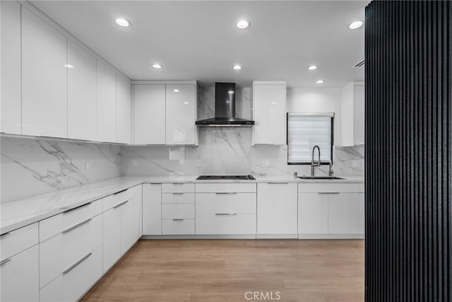 16810 Adlon Rd, Encino, CA 91436 - kitchen with wall chimney range hood, modern cabinets, white cabinets, tasteful backsplash, and recessed lighting