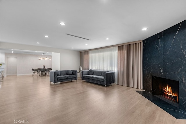 16810 Adlon Rd, Encino, CA 91436 - living area with wood finished floors, a high end fireplace, and recessed lighting