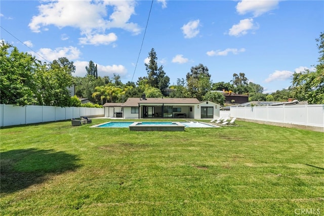 16810 Adlon Rd, Encino, CA 91436 - rear view of property featuring a fenced backyard, a pool with connected hot tub, and a patio