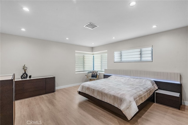 16810 Adlon Rd, Encino, CA 91436 - bedroom with light wood-type flooring, multiple windows, and recessed lighting