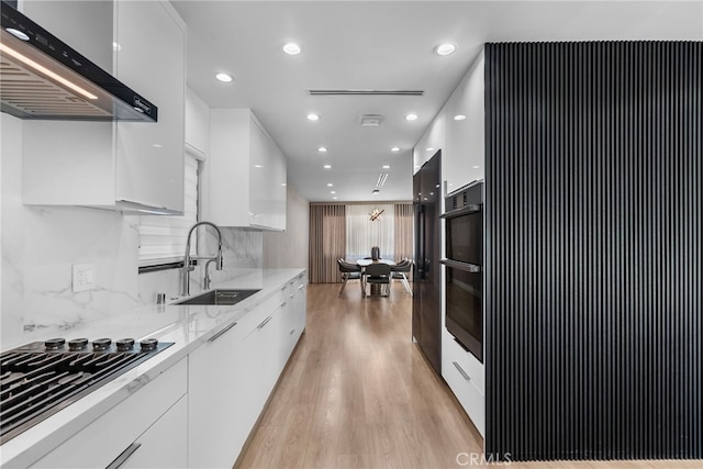 16810 Adlon Rd, Encino, CA 91436 - kitchen featuring modern cabinets, wall chimney range hood, white cabinetry, and recessed lighting