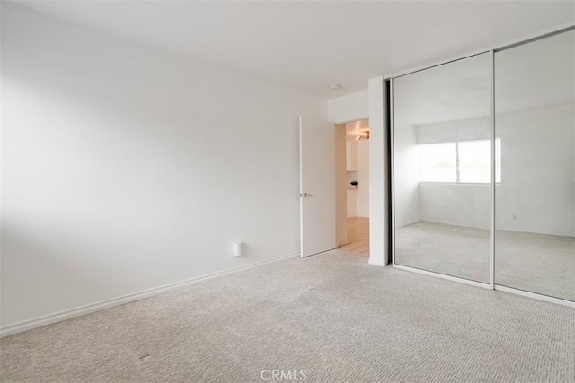 4727 W 147th St Unit 133, Lawndale, CA 90260 - unfurnished bedroom featuring carpet flooring and a closet