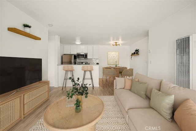 4727 W 147th St Unit 133, Lawndale, CA 90260 - living area with light wood-type flooring and a heating unit