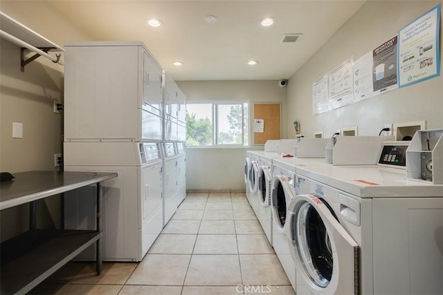 4727 W 147th St Unit 133, Lawndale, CA 90260 - shared laundry room with washer and clothes dryer, stacked washer / drying machine, light tile patterned floors, and recessed lighting